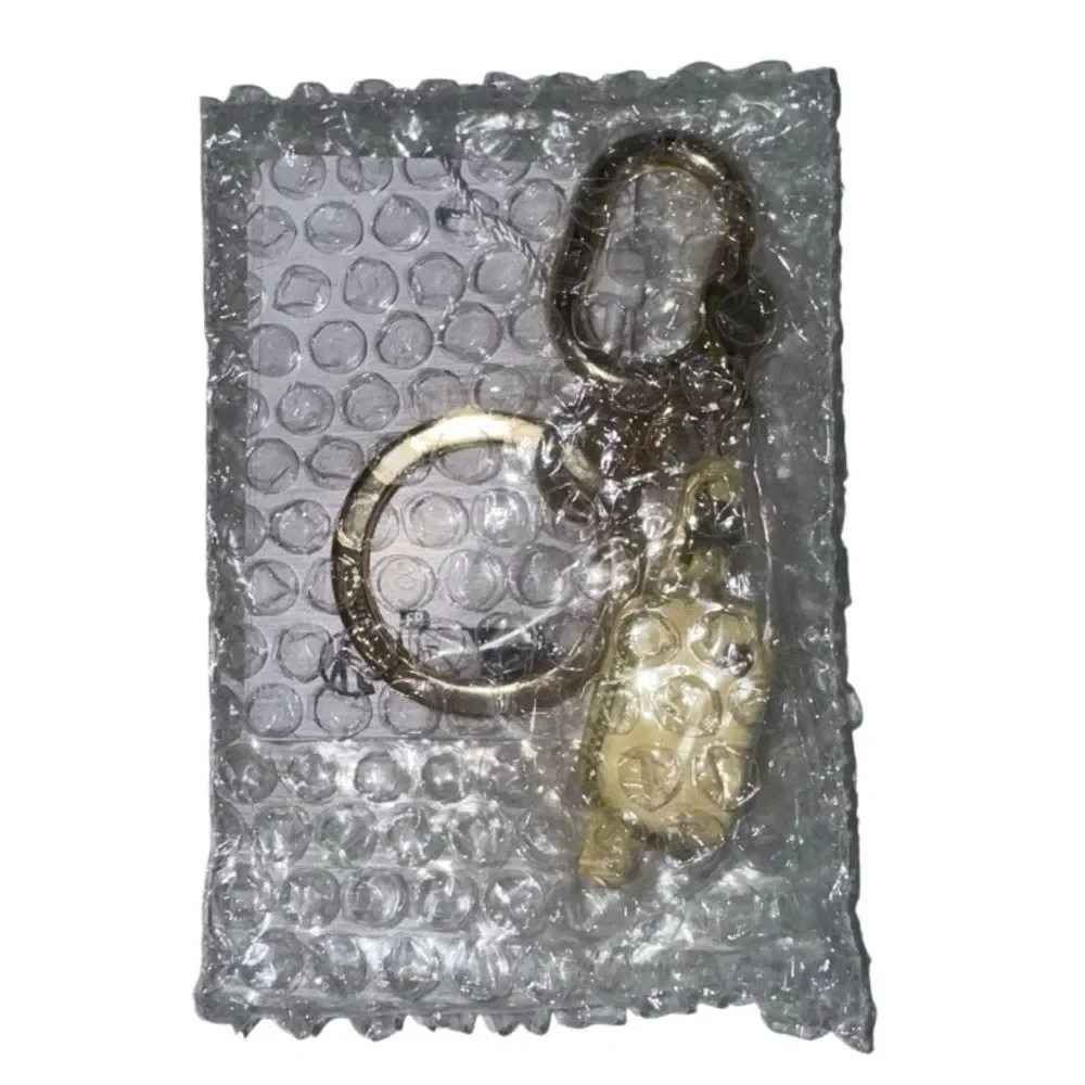 Everywhere Belt Bag Key Charm Butter Cream/Gold Key Charm